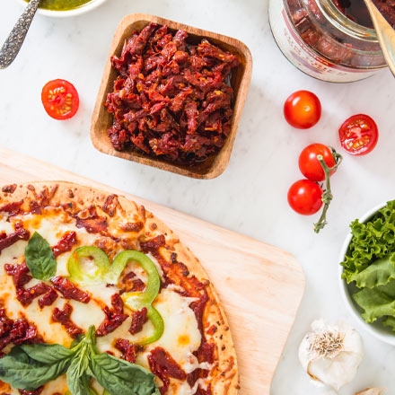 Pizza topped with California Sun Dried Tomatoes